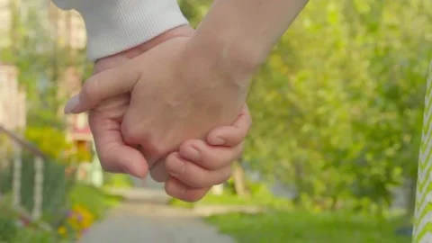 Lovers walk holding hands Stock Footage 183934557