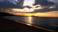 Lovers Walking and Hugging along the Beach at Sunset. Colorful Seascape of HD Footage