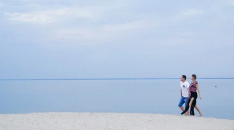 Lovers walking on the bank of the river Stock Footage 67403778