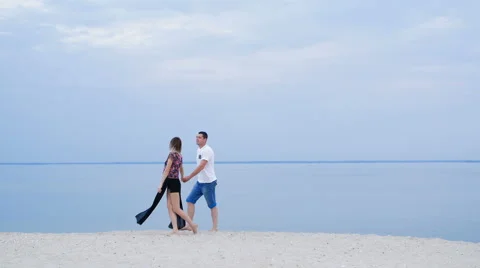 Lovers walking on the bank of the river Stock Footage 67403893