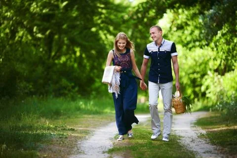 Lovers walking in forest Stock Photos