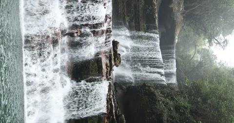 Lovers at water fall Vertical shot Stock-Footage 340118591