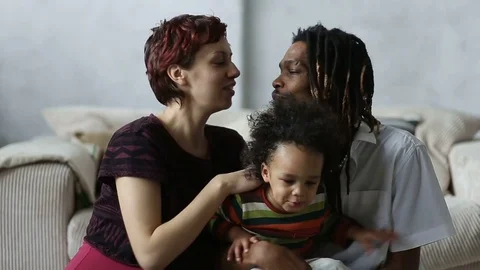 Loving affectionate mixed couple's sensual kiss Stock Footage 73780147