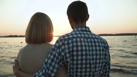 Loving couple admiring the sunset Stock Footage