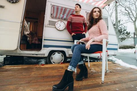 Loving couple alone in a trailer on a trip. Romance for lovers. Stock Photos