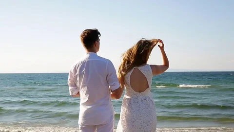 A loving couple on the beach Stock Footage 81093387
