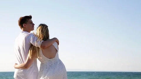 A loving couple on the beach Stock Footage 81095266