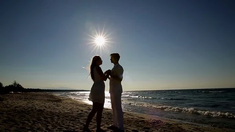 A loving couple on the beach Stock Footage 81096056