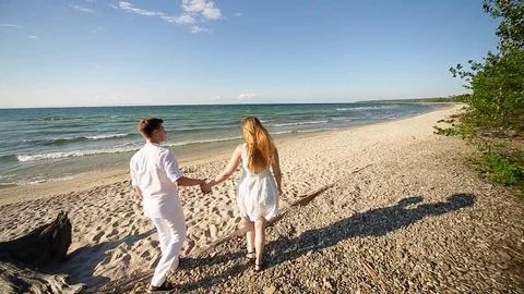 A loving couple on the beach Stock Footage 81114117