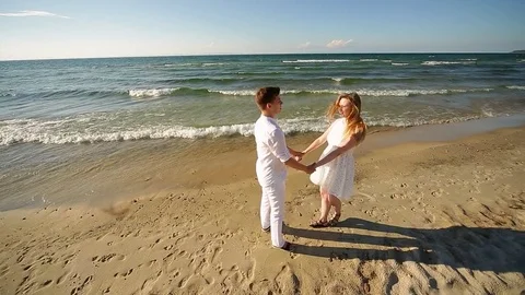 A loving couple on the beach Stock Footage 81116246
