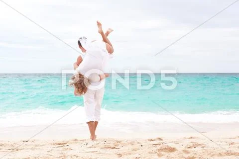 Loving couple on beach Stock Photos