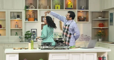 Loving Couple Dancing In Kitchen While Cooking Stock Footage 255423881