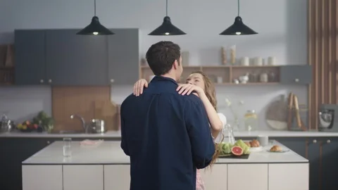 Loving couple dancing slowly at kitchen. Two fancy people enjoying time together Stock Footage 130168883