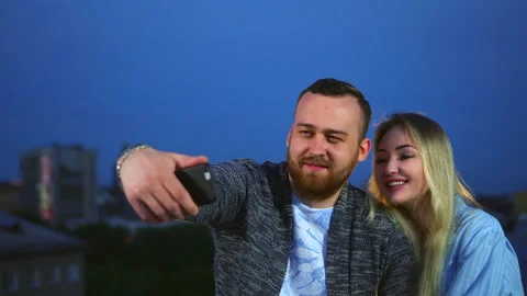 Loving couple on date making selfie on phone with smile face in night city 4K. Stock Footage 138245271