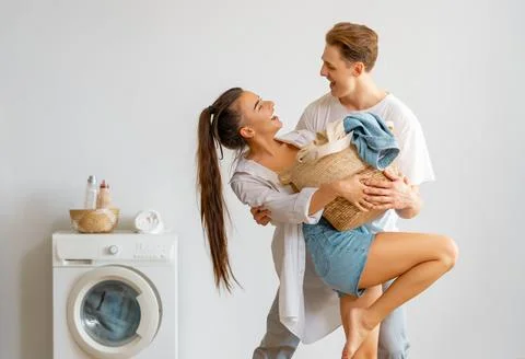 Loving couple is doing laundry Foto stock