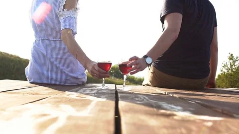 Loving couple drinking wine at sunset. Romantic date Stock Footage