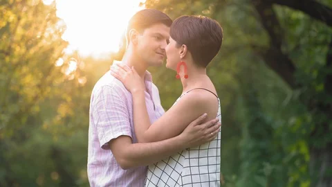 Loving Couple Embraces In The Summer Park Stock Footage 130128853