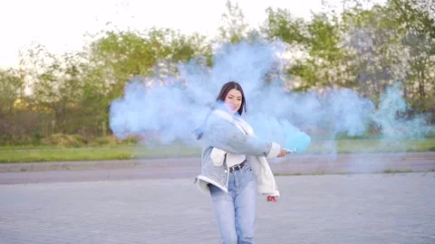 Loving couple feels joyful Young happy adult hipster girl with smoke grenade  Stock Footage 142829582