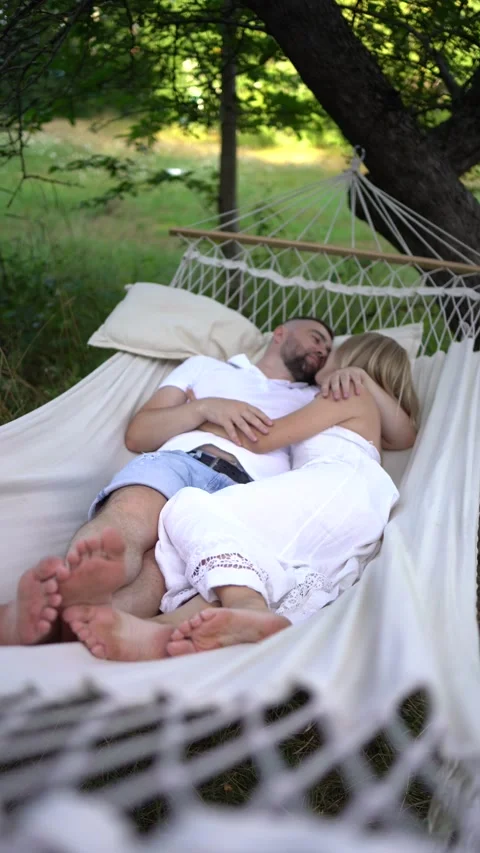 Loving couple in hammock, millennials Stock Footage 280350824