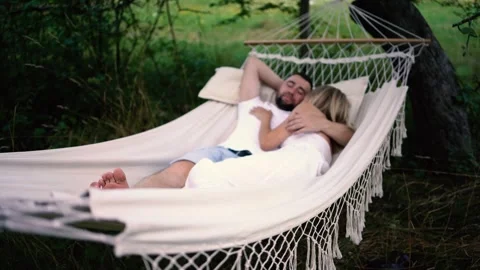Loving couple in hammock, millennials Stock Footage 280350863
