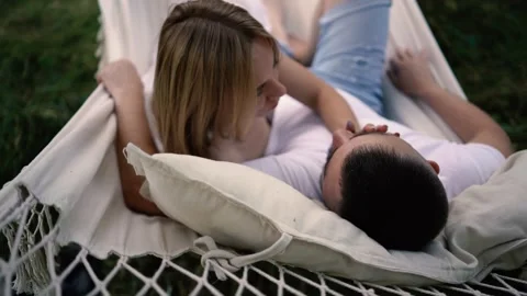 Loving couple in hammock, millennials Stock Footage 280350871
