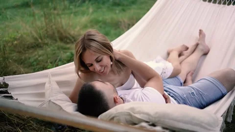 Loving couple in hammock, millennials Stock Footage 280350874