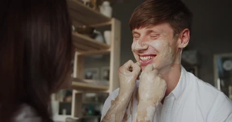 Loving couple having fun in pottery workshop Stock Footage 143080059