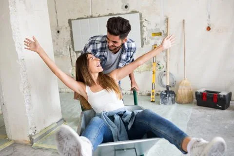 Loving couple is having fun while they are renovating house Foto stock