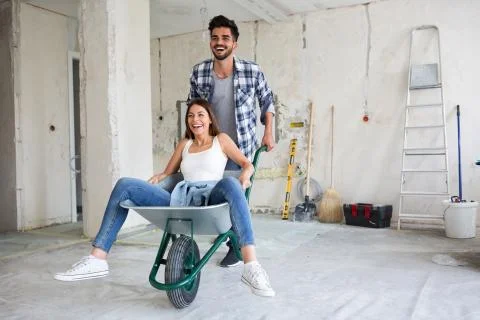 Loving couple is having fun while they are renovating house Stock-Fotos