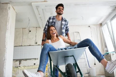 Loving couple is having fun while they are renovating house Stock-Fotos
