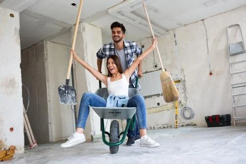Loving couple is having fun while they are renovating house 写真素材