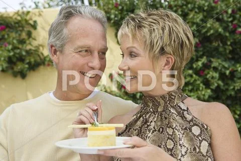 Loving Couple Having Sweet Dish Stock Photos