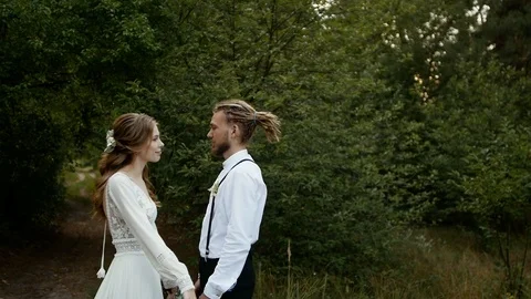 Loving couple hugs very affectionately and leans against his forehead Stock Footage 123727634