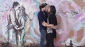 loving couple kissing in graffiti behind a couple kissing - love - hug HD Footage