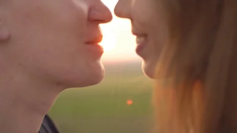 Loving couple kissing at sunset. Stock Footage