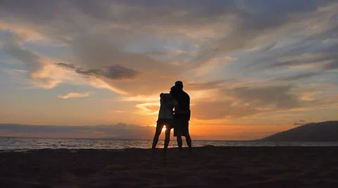 Loving Couple at Ocean Sunset Stock Footage 23856045