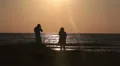 Loving couple photographing on seaside during sunset, Cyprus HD Footage