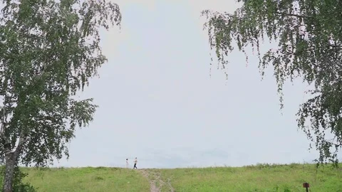 A loving couple runs towards each other in a clearing Video stock 328299538