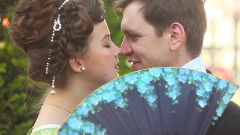 Loving couple in suits Stockbeeldmateriaal 76429927