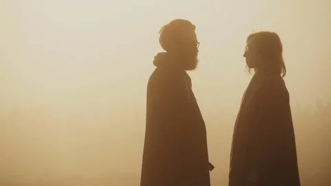 A loving couple in the sunny light rays of sunset happy Stock Footage 72921165