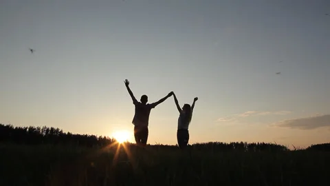 Loving couple at sunset in the field Stock Footage 95064522