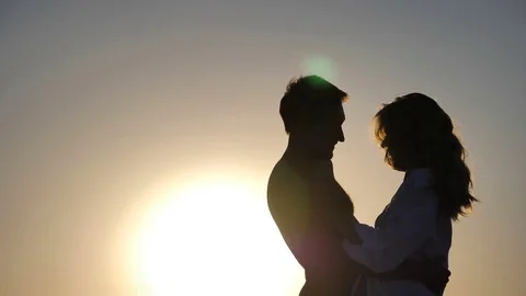 Loving couple at sunset Видео 83601210