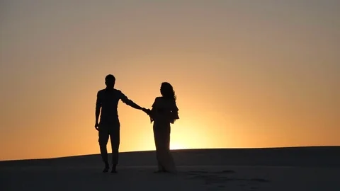 Loving couple at sunset Видео 83601751