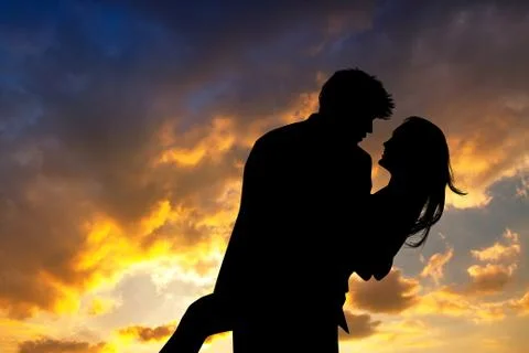Loving couple at sunset Stock Illustration