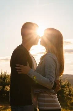 Loving couple, sunset Stock Photos