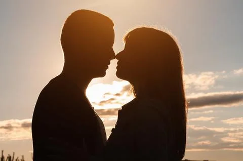 Loving couple, sunset Stock Photos