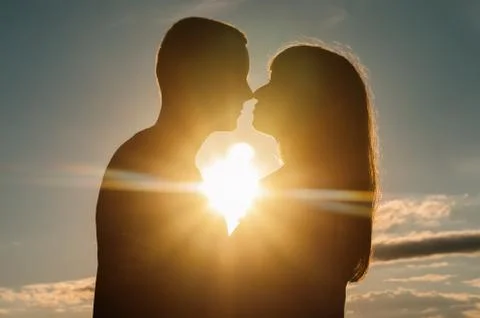 Loving couple, sunset Stock Photos
