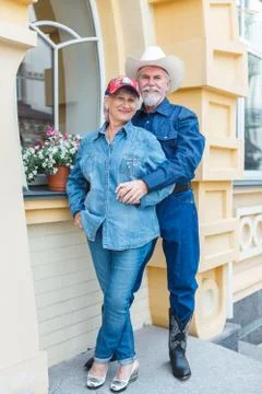 Loving elderly couple posing on camera. Stock Photos