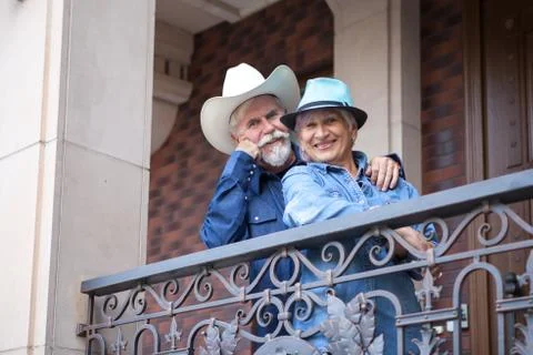 Loving elderly couple posing on camera. Pensioners hug each other. Happy old  Stock Photos