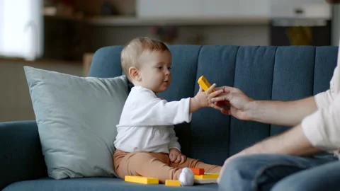 Loving father developing his little girl with wooden figure toys, adorable baby Vidéo 236416242